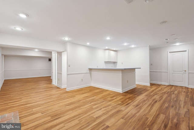 9313 Braymore Cir, Fairfax Station, VA 22039 - below grade area featuring recessed lighting, light wood-style flooring, and baseboards