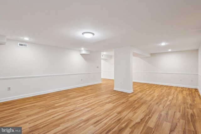9313 Braymore Cir, Fairfax Station, VA 22039 - finished basement with baseboards, light wood finished floors, visible vents, and recessed lighting