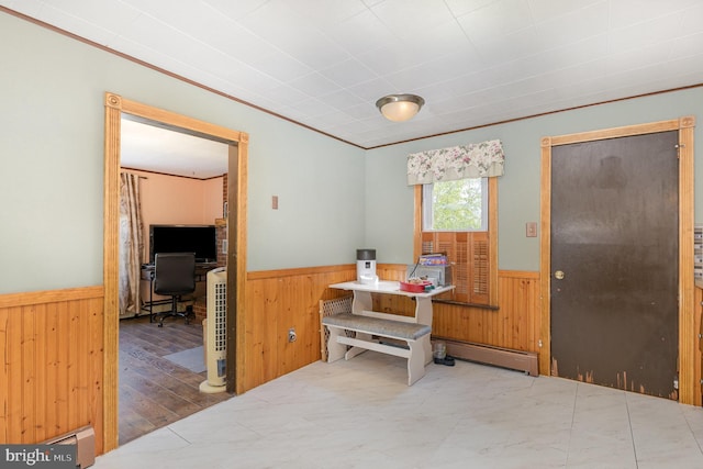 interior space featuring wood walls and wainscoting