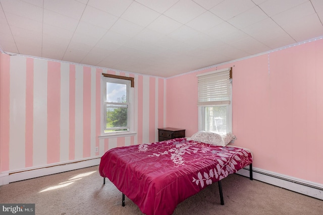 bedroom featuring carpet floors, baseboard heating, and wallpapered walls