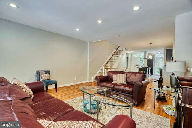 1273 Delaware Ave SW Unit 66, Washington, DC 20024 - living room featuring stairway, wood finished floors, recessed lighting, and baseboards