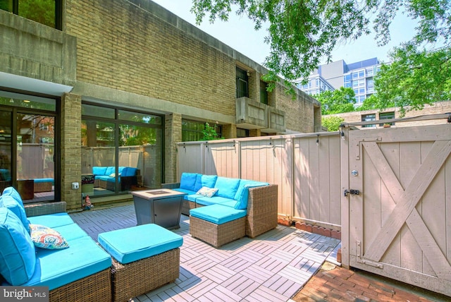 1273 Delaware Ave SW Unit 66, Washington, DC 20024 - view of patio / terrace with an outdoor living space with a fire pit and a gate