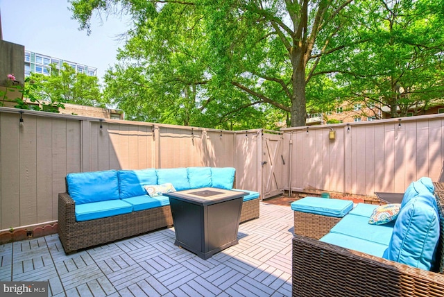 1273 Delaware Ave SW Unit 66, Washington, DC 20024 - fenced backyard featuring an outdoor living space with a fire pit, a gate, and a patio