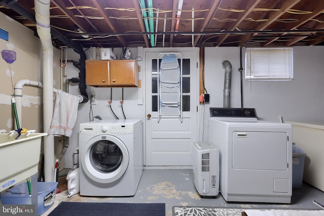 laundry area with washing machine and dryer and laundry area