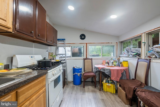 7020 Parsons Ln, Port Norris, NJ 08349 - kitchen featuring white gas range, lofted ceiling, light wood-style flooring, and recessed lighting