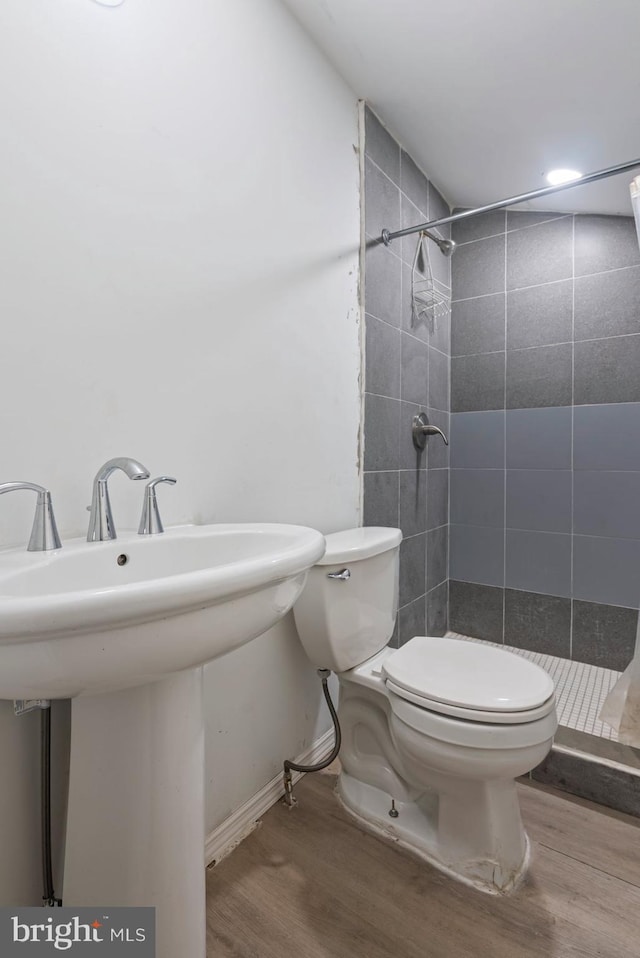 7020 Parsons Ln, Port Norris, NJ 08349 - full bathroom with wood finished floors, a stall shower, toilet, and a sink