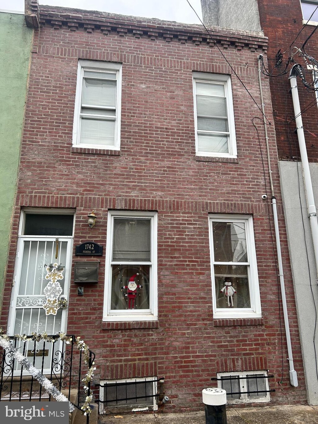 view of property exterior with brick siding