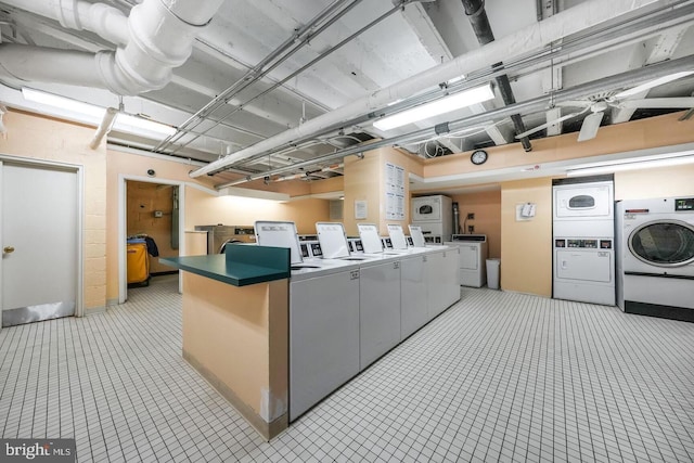welcome area with washer and dryer and stacked washer and clothes dryer