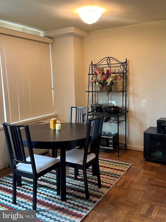 dining space featuring baseboards