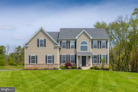 7 Nicole Cir, Pedricktown, NJ 08067 - colonial inspired home with a front lawn and stone siding