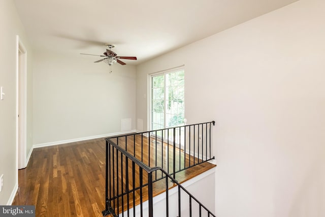 5310 Orchardson Ct, Fairfax, VA 22032 - hallway with an upstairs landing, wood finished floors, and baseboards