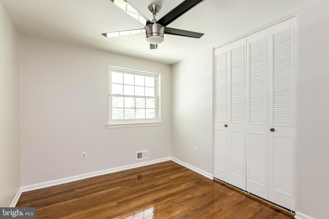 5310 Orchardson Ct, Fairfax, VA 22032 - unfurnished bedroom with a closet, baseboards, dark wood finished floors, and ceiling fan