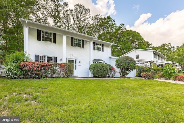 5310 Orchardson Ct, Fairfax, VA 22032 - greek revival inspired property with a front lawn and brick siding