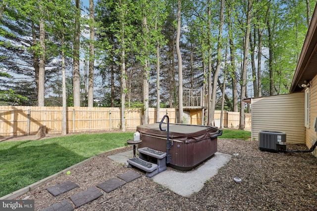 7303 Westwind Ct, Bowie, MD 20715 - view of yard with central AC unit, a fenced backyard, and a hot tub