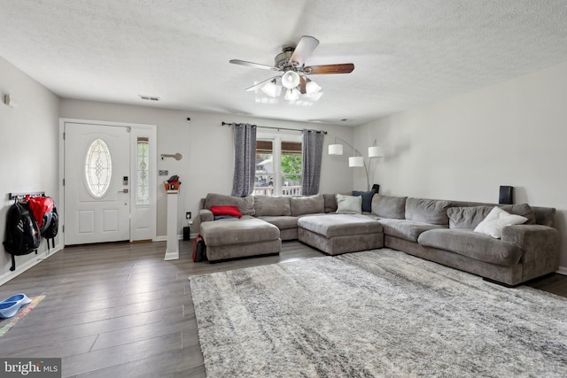 7303 Westwind Ct, Bowie, MD 20715 - living room featuring a ceiling fan, visible vents, wood finished floors, and a textured ceiling