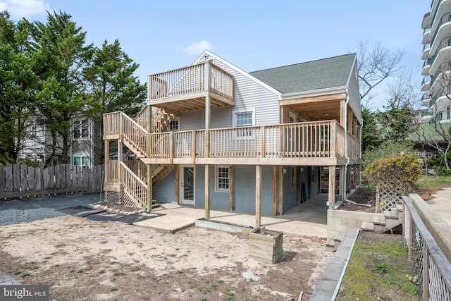 10 34th St, Ocean City, MD 21842 - back of property featuring a patio, roof with shingles, stairway, a deck, and fence