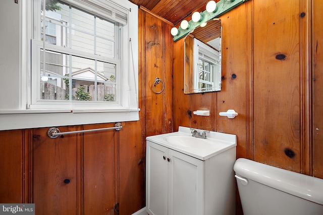 10 34th St, Ocean City, MD 21842 - half bath featuring wooden walls, toilet, and vanity