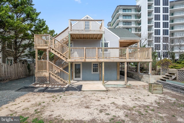 10 34th St, Ocean City, MD 21842 - rear view of house with fence, stairway, a deck, and a patio