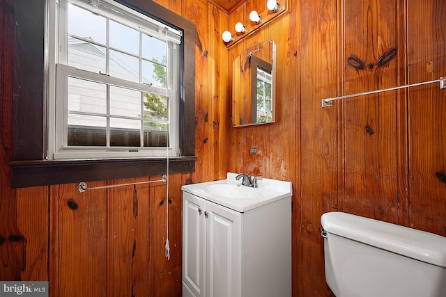 10 34th St, Ocean City, MD 21842 - bathroom with toilet, wood walls, and vanity