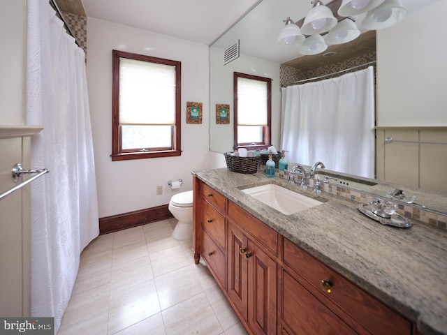 110 Clay Ridge Rd, Ottsville, PA 18942 - bathroom with vanity, toilet, plenty of natural light, and baseboards