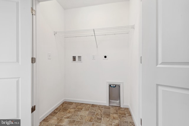 laundry area featuring baseboards, washer hookup, laundry area, electric dryer hookup, and stone finish flooring
