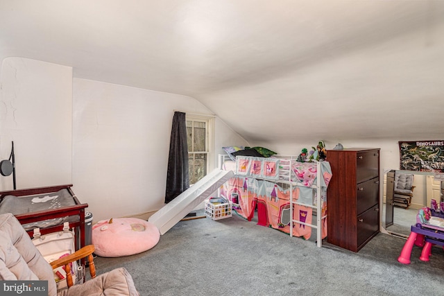 rec room featuring lofted ceiling and carpet