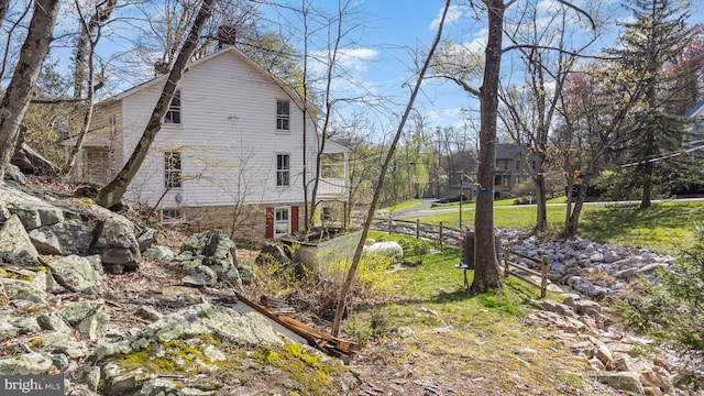 view of property exterior with a yard