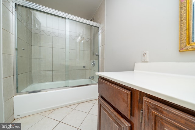 full bath featuring shower / bath combination with glass door, tile patterned floors, and vanity