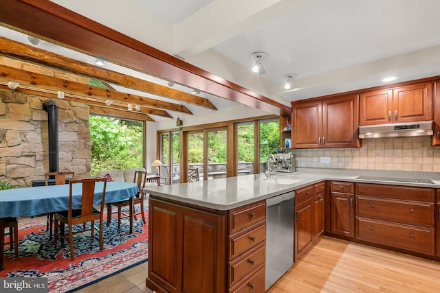 552 Brookwood Rd, Wayne, PA 19087 - kitchen featuring stainless steel dishwasher, under cabinet range hood, a peninsula, black electric cooktop, and a wood stove