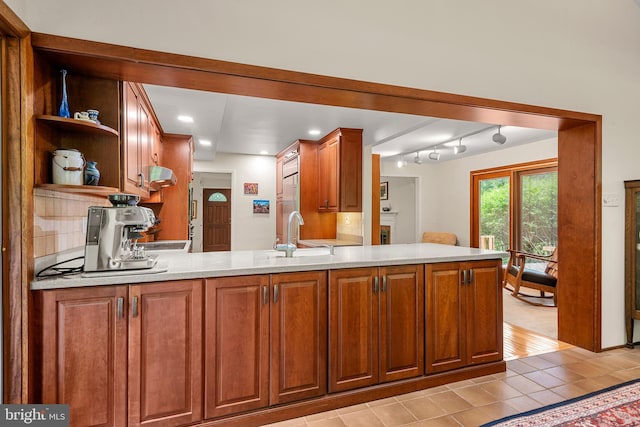 552 Brookwood Rd, Wayne, PA 19087 - kitchen with light countertops, open shelves, light tile patterned floors, a peninsula, and ventilation hood