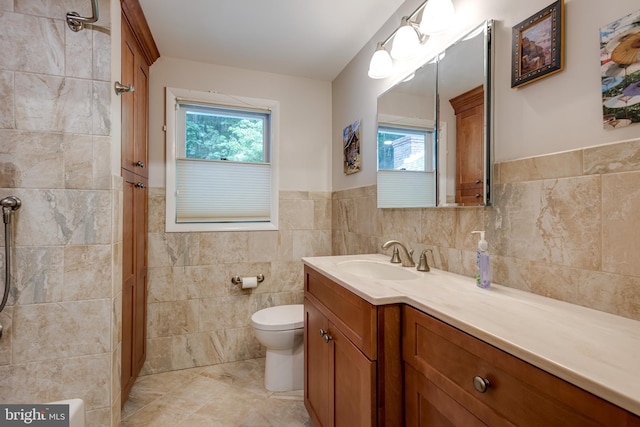 552 Brookwood Rd, Wayne, PA 19087 - bathroom with plenty of natural light, tile walls, vanity, a shower, and a wainscoted wall
