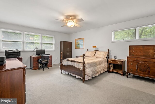 552 Brookwood Rd, Wayne, PA 19087 - bedroom featuring an office area, light colored carpet, multiple windows, and a ceiling fan