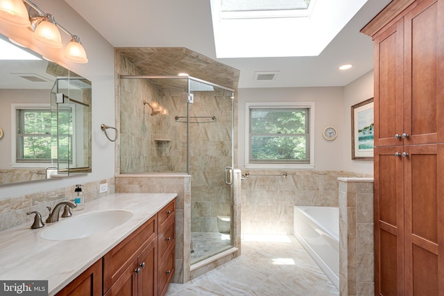 552 Brookwood Rd, Wayne, PA 19087 - full bath with vanity, a garden tub, a skylight, and plenty of natural light