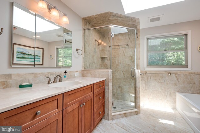 552 Brookwood Rd, Wayne, PA 19087 - full bath with vanity, a garden tub, tile walls, and a stall shower