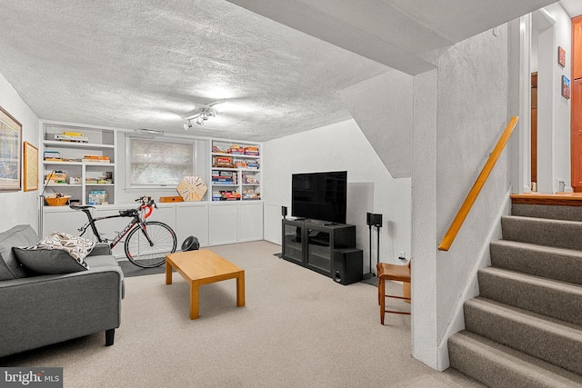 552 Brookwood Rd, Wayne, PA 19087 - carpeted living room with stairway, a textured ceiling, and built in features