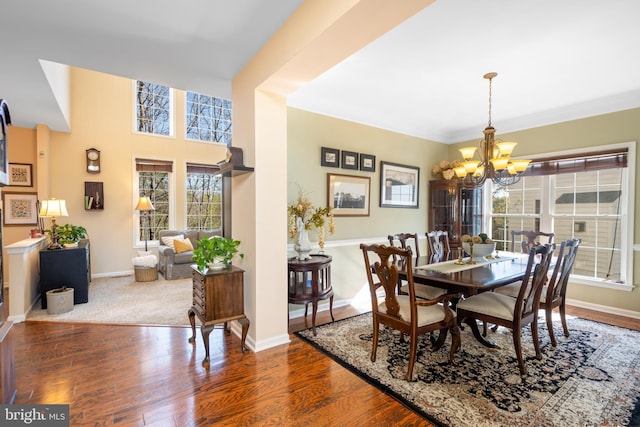 109 Aulee Ct, Winchester, VA 22602 - dining room with wood finished floors, baseboards, and an inviting chandelier