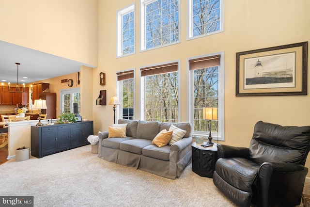109 Aulee Ct, Winchester, VA 22602 - living room featuring a chandelier, carpet, a high ceiling, and recessed lighting