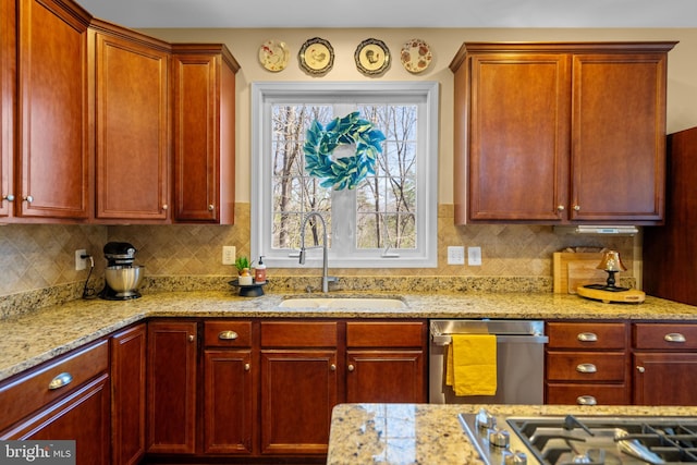 109 Aulee Ct, Winchester, VA 22602 - kitchen featuring light stone counters, reddish brown cabinets, a sink, tasteful backsplash, and appliances with stainless steel finishes