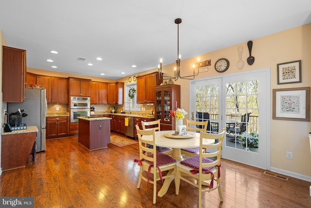 109 Aulee Ct, Winchester, VA 22602 - dining room with visible vents, plenty of natural light, dark wood-style floors, and recessed lighting