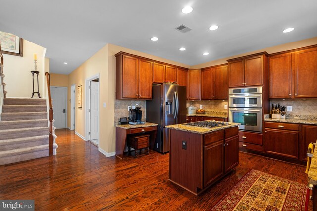 109 Aulee Ct, Winchester, VA 22602 - kitchen featuring light stone countertops, stainless steel appliances, dark wood-style floors, and backsplash