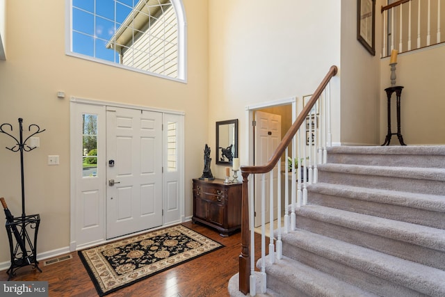 109 Aulee Ct, Winchester, VA 22602 - entryway featuring a high ceiling, wood finished floors, visible vents, and stairs