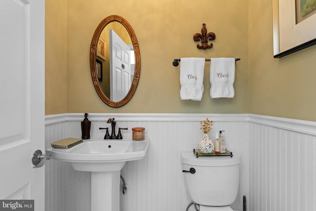 109 Aulee Ct, Winchester, VA 22602 - bathroom featuring a decorative wall, toilet, and wainscoting