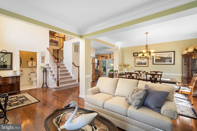 109 Aulee Ct, Winchester, VA 22602 - living area featuring ornamental molding, wood finished floors, a notable chandelier, and stairway