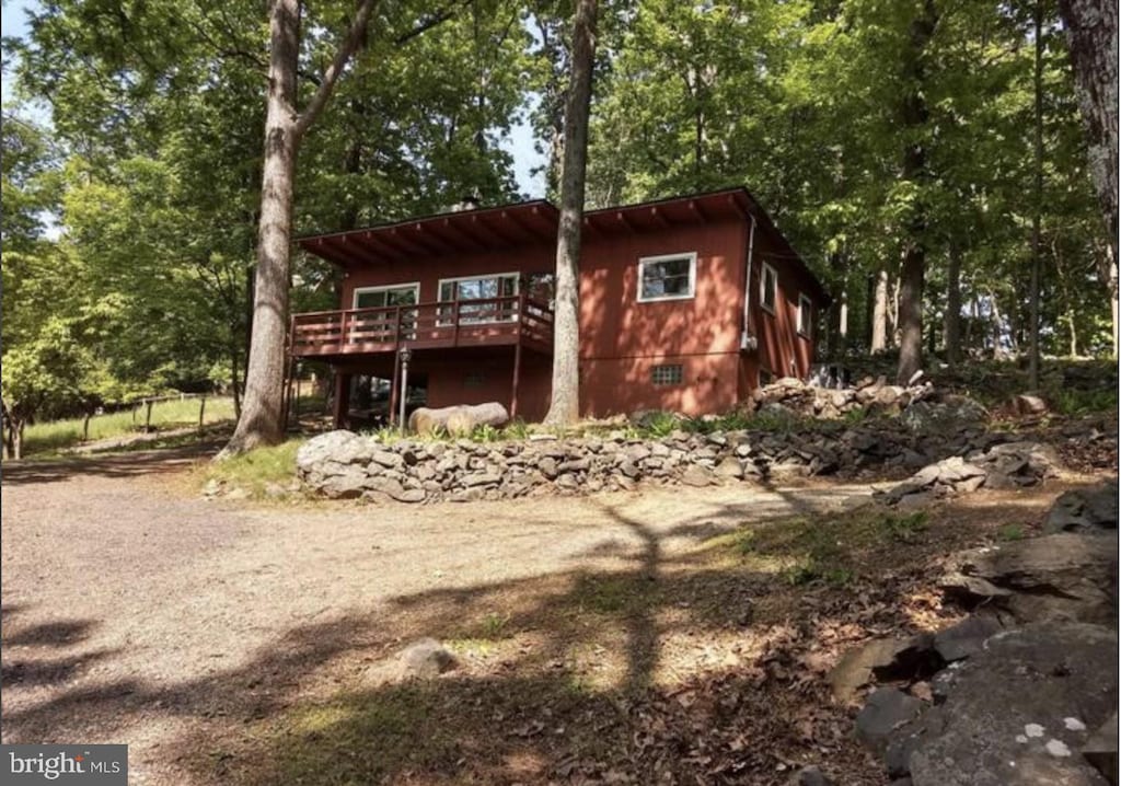 exterior space featuring crawl space and a deck
