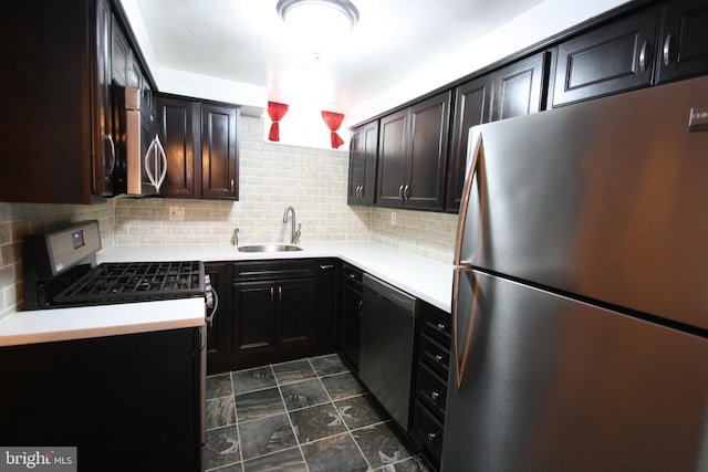 506 S 11th St Unit 33, Philadelphia, PA 19147 - kitchen featuring light countertops, a sink, backsplash, and appliances with stainless steel finishes