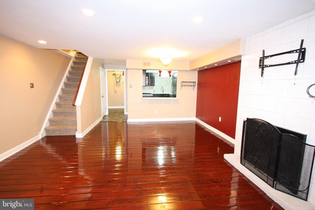 506 S 11th St Unit 33, Philadelphia, PA 19147 - unfurnished living room with a fireplace, recessed lighting, stairs, baseboards, and hardwood / wood-style flooring