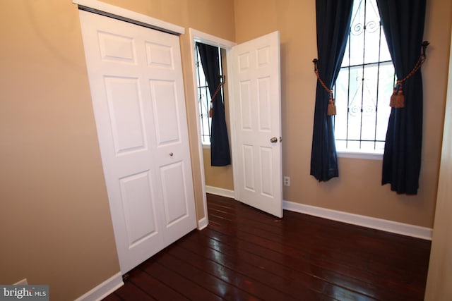 506 S 11th St Unit 33, Philadelphia, PA 19147 - unfurnished bedroom featuring baseboards and dark wood finished floors
