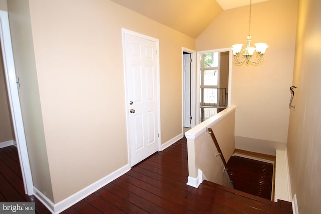 506 S 11th St Unit 33, Philadelphia, PA 19147 - corridor with dark wood-type flooring, a chandelier, lofted ceiling, an upstairs landing, and baseboards