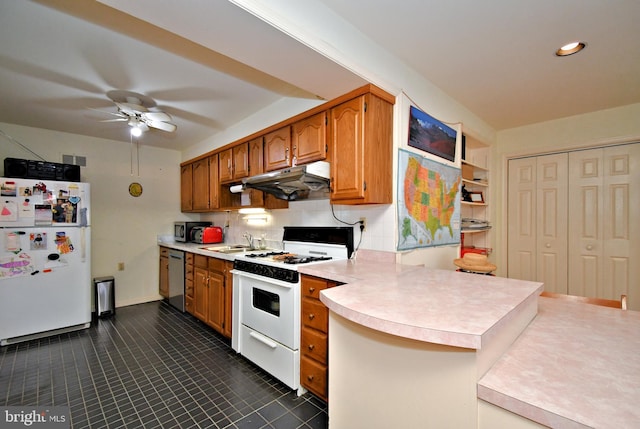 kitchen featuring ceiling fan, light countertops, a sink, under cabinet range hood, and white appliances