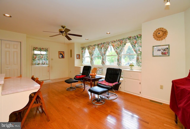 sitting room with visible vents, baseboards, ceiling fan, recessed lighting, and light wood-style flooring